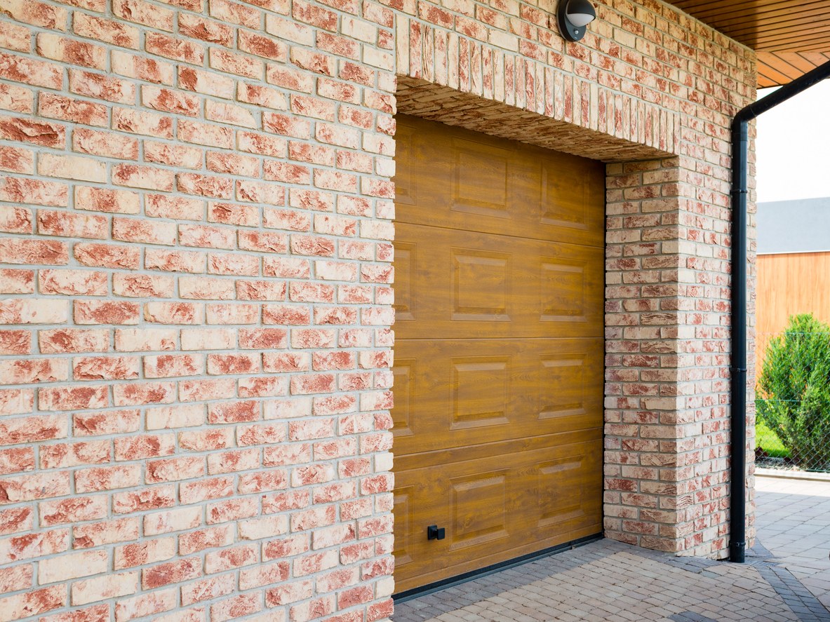 Wooden Garage Door with brick wall background